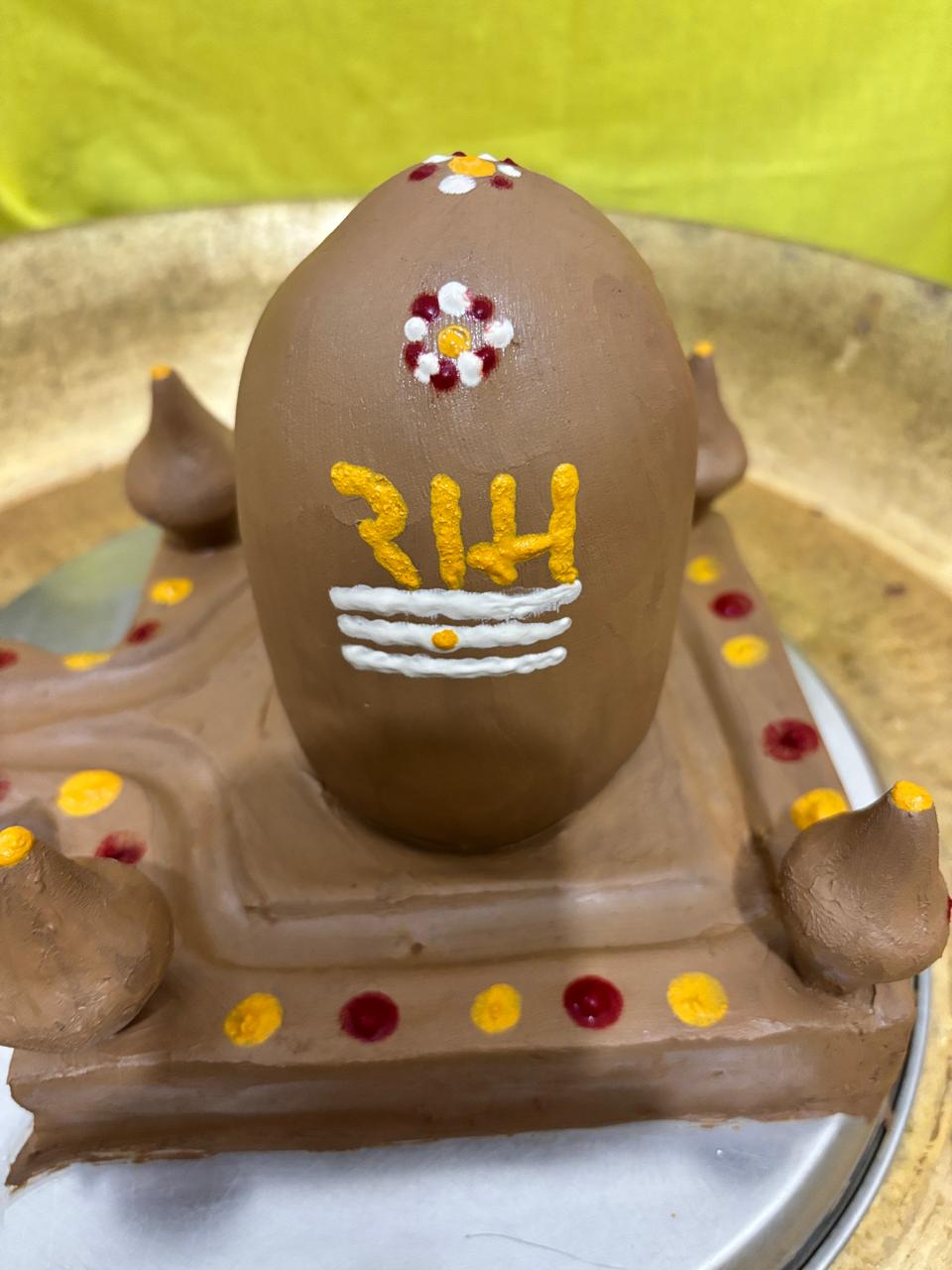 Hand-finished earthen Shiva lingam with sacred markings.